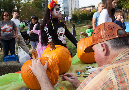 Man carving pumpkins