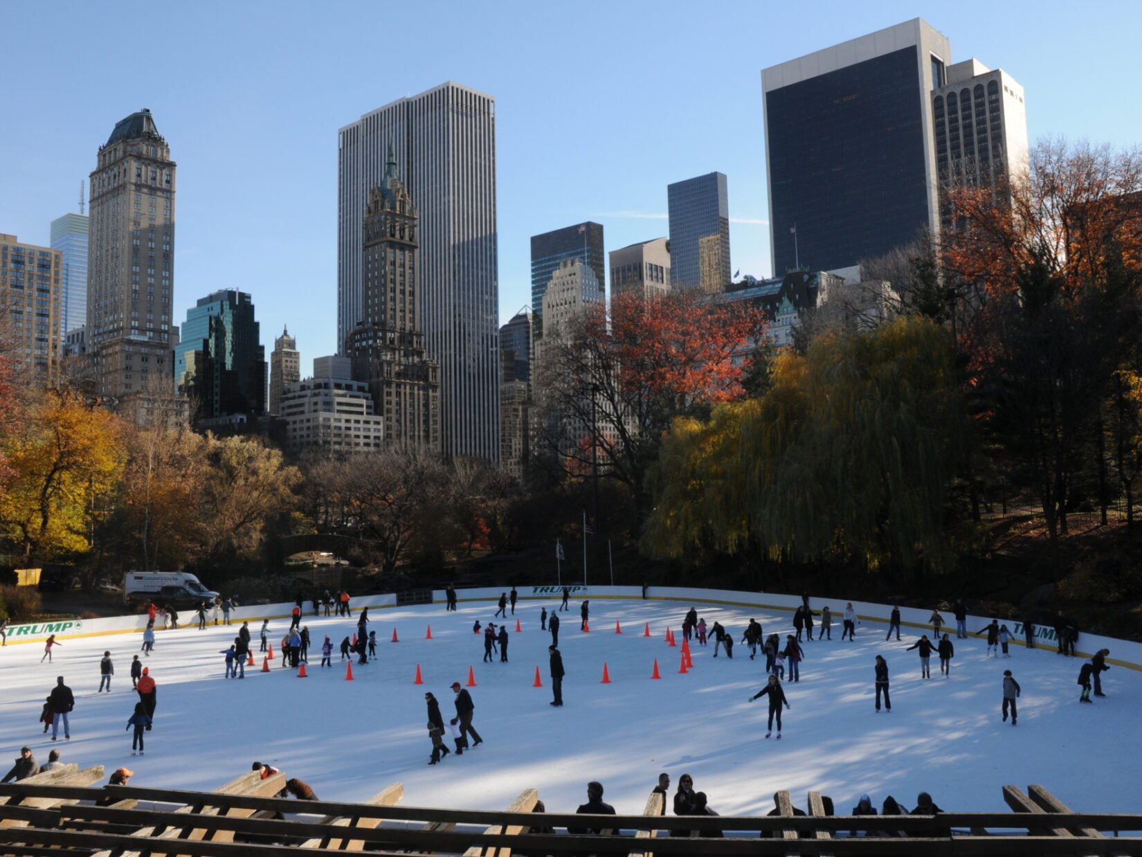 Skaters enjoy the Wollman Rink beneath the skyline