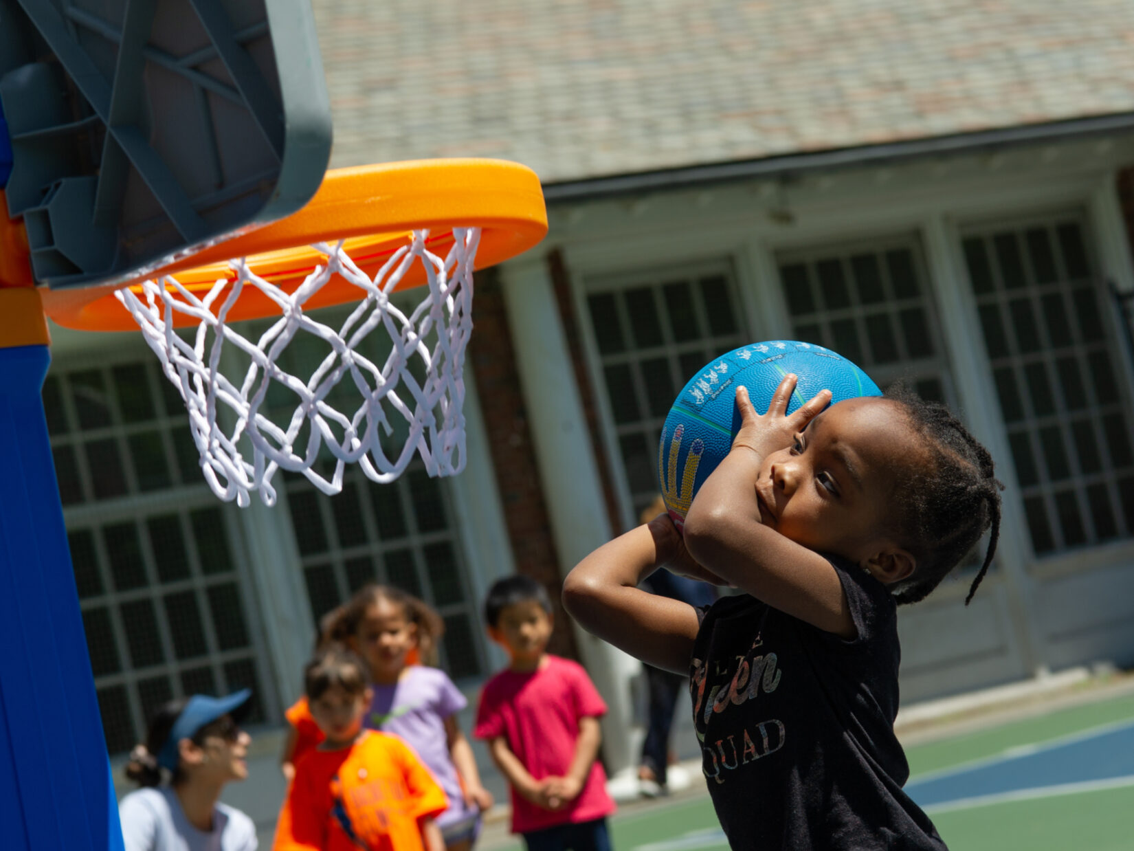 A future WNBA star prepares to shoot a basket