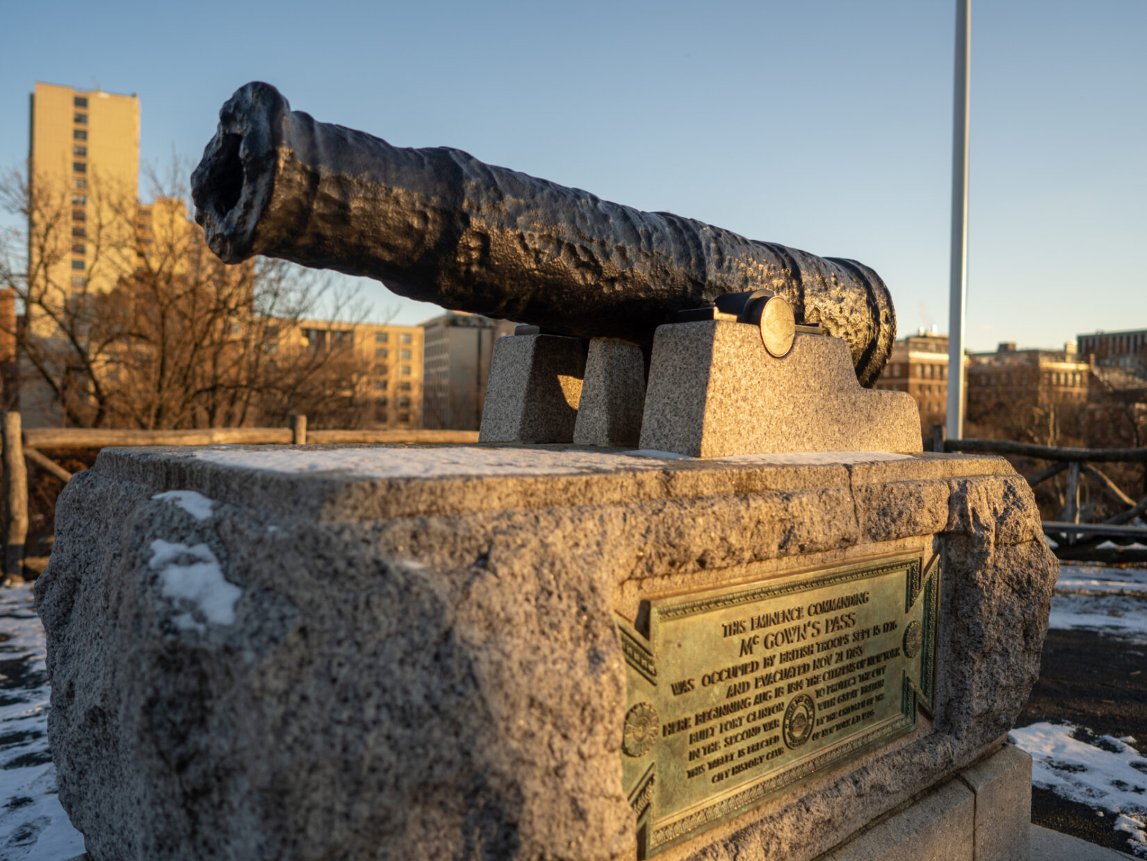 A canon commemorates the location of McGowan's Pass, with a slice of the Harlem skyline in the background.