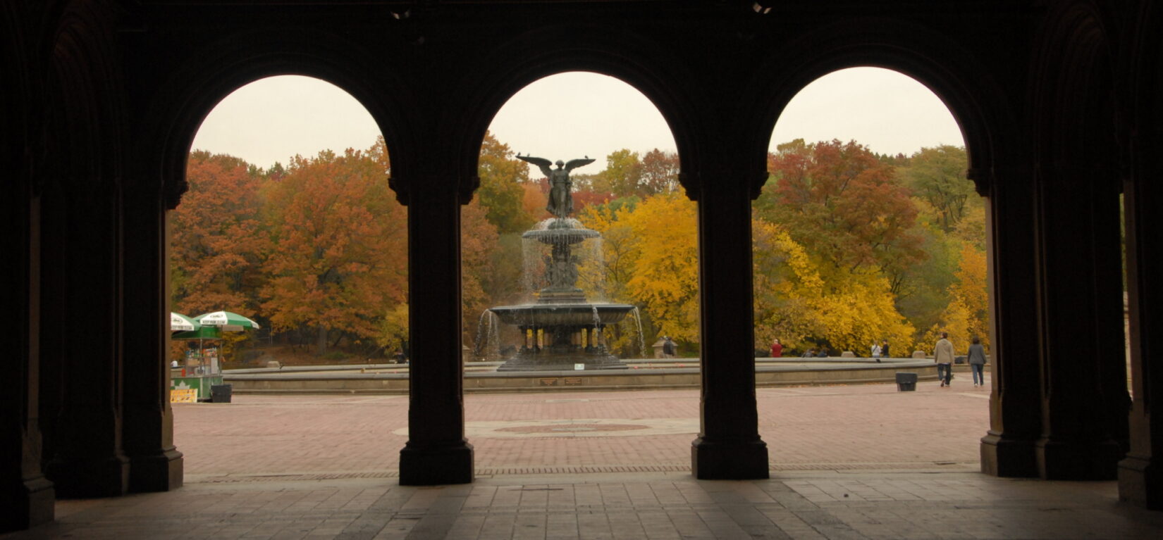 Looking through the shadowed arches of the Arcade to Bethesda Terrace