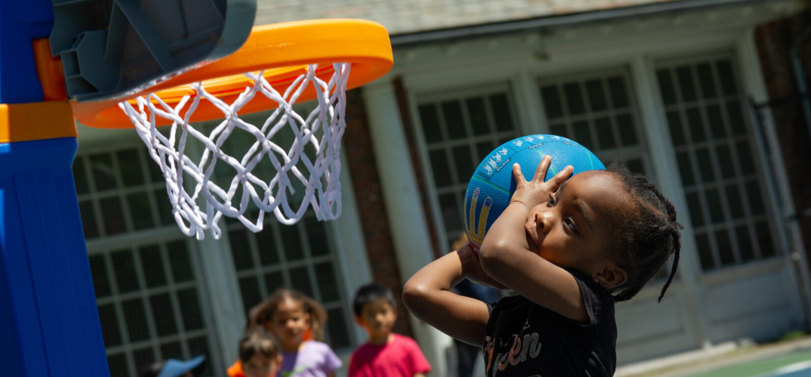 A future WNBA star prepares to shoot a basket