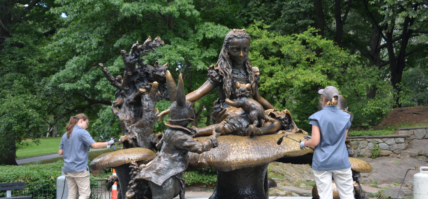 Conservation interns work on the popular statue