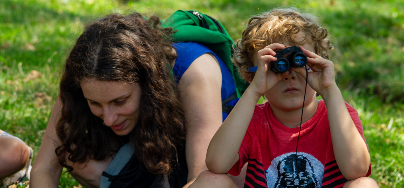 A small boy plays with the contents of his Discovery Bag