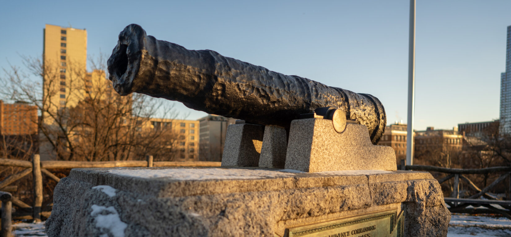 A canon commemorates the location of McGowan's Pass, with a slice of the Harlem skyline in the background.
