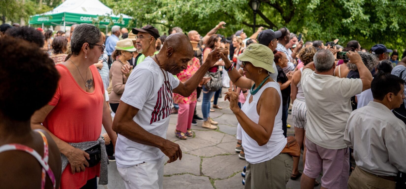 Attendees dancing in the crowd and enjoying the jazz