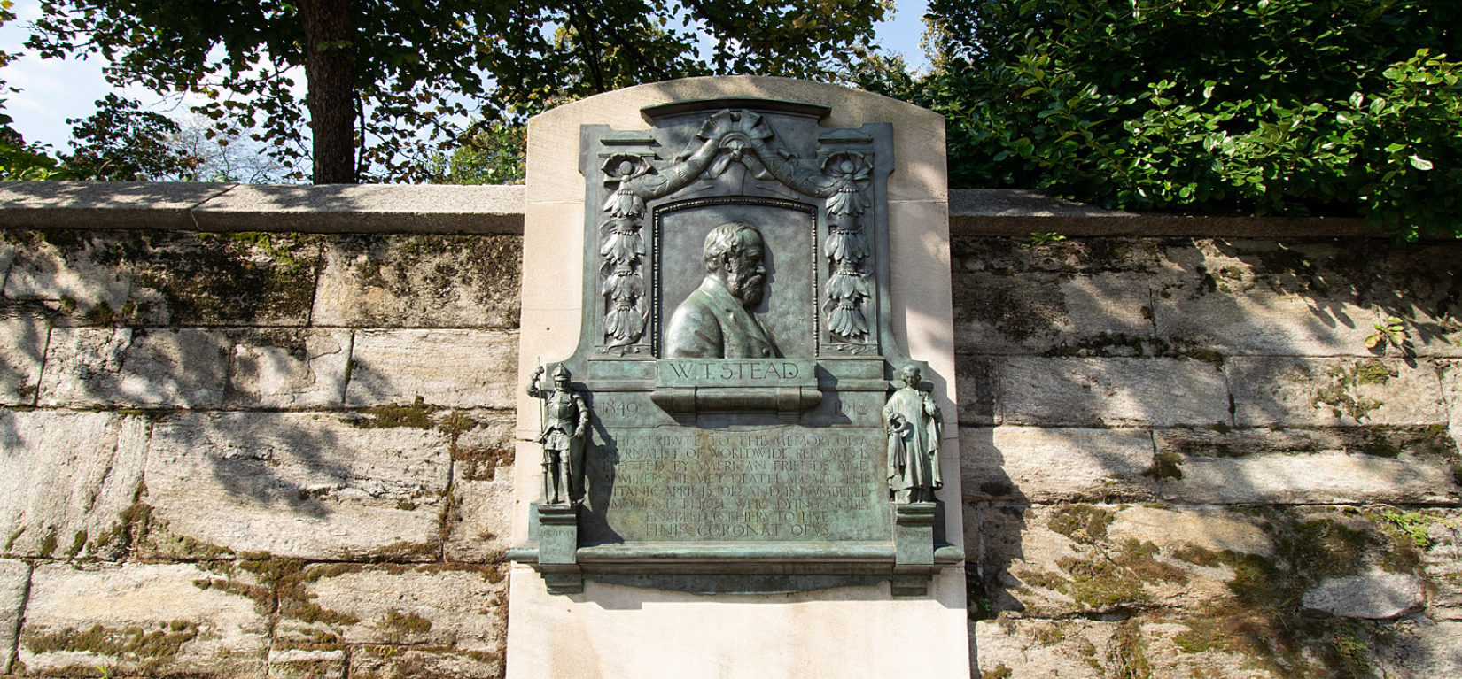 The memorial plaque viewed on the perimeter in summer