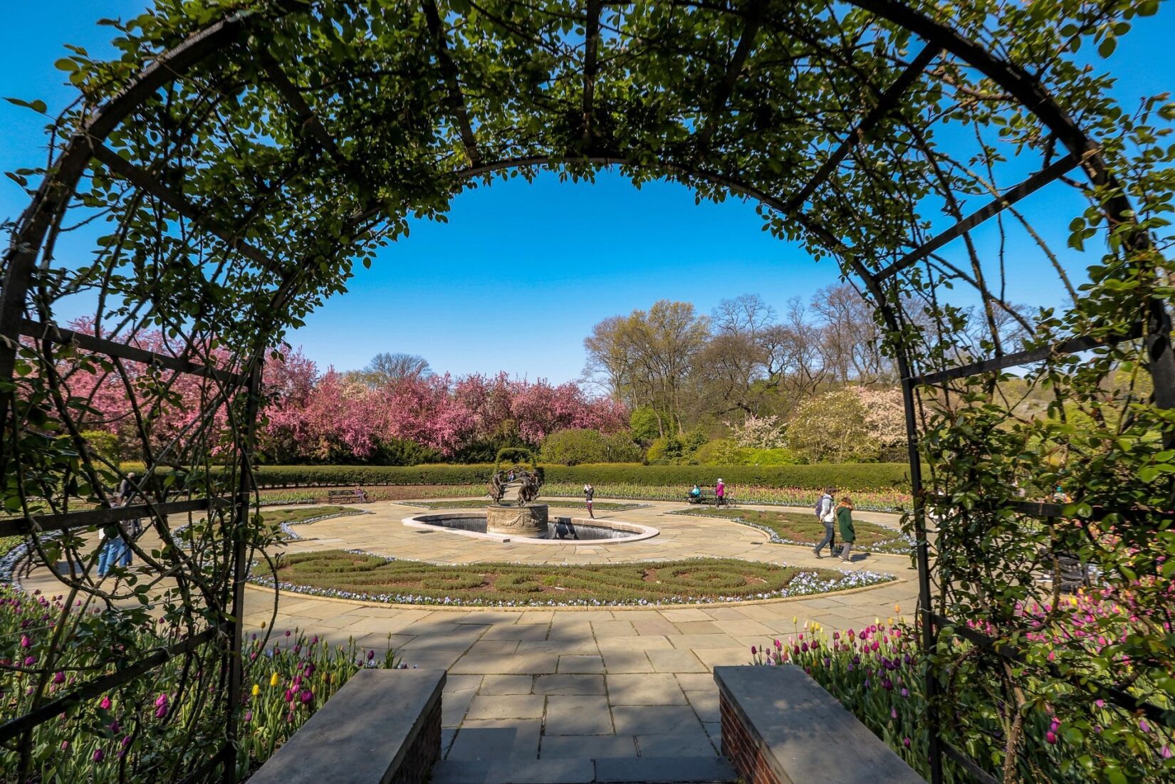 A view of the North Garden, showing the fountain seen through a pergola.