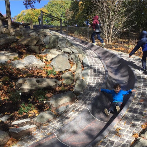 A child enjoying the slide, after reconstruction