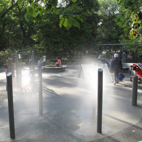 Water features spray the restored playground