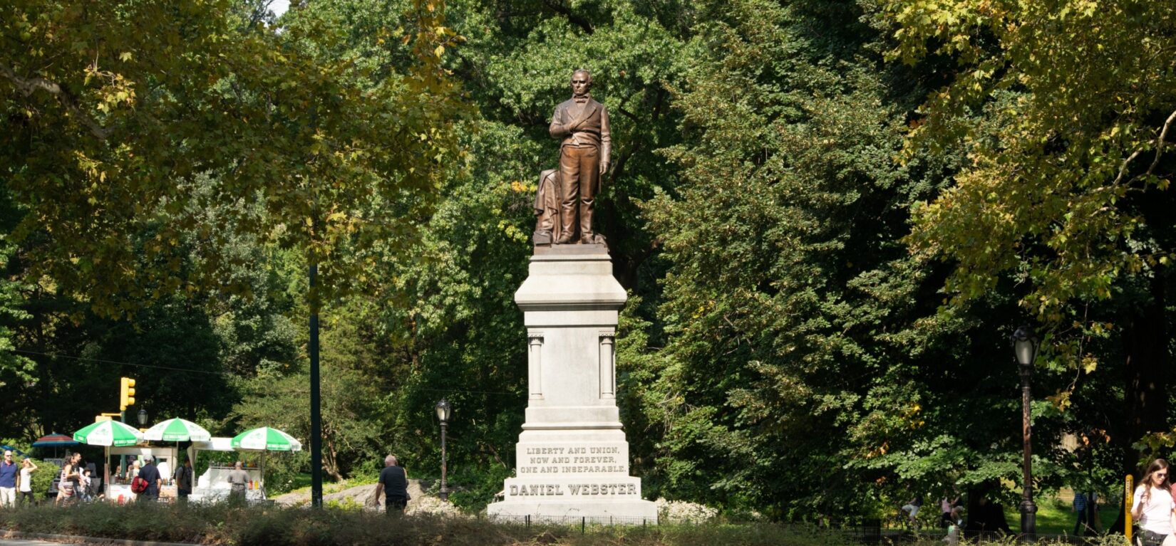 The bronze statue stands high on a noble pedestal